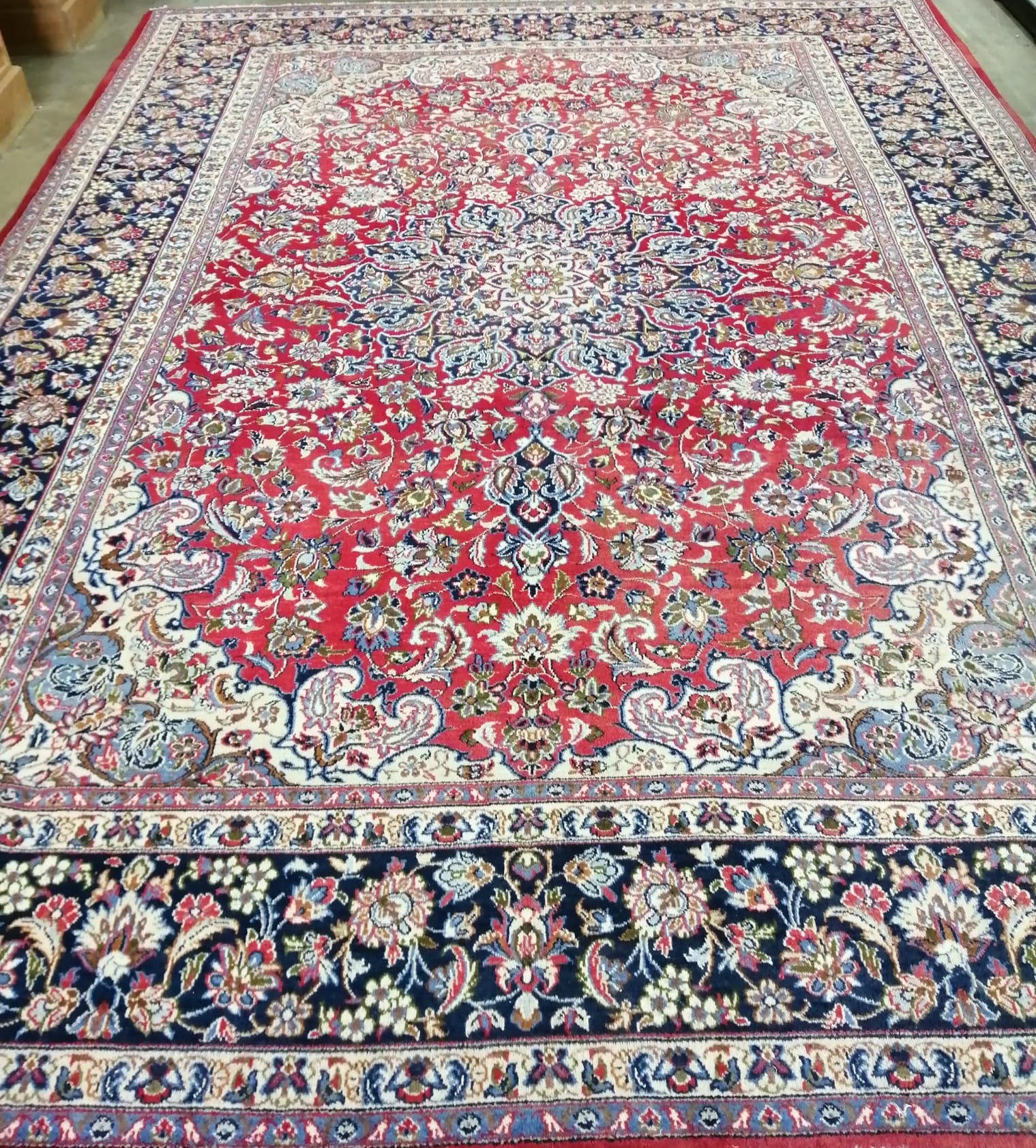 A large Najafabad red ground carpet, approx. 400 x 300cm